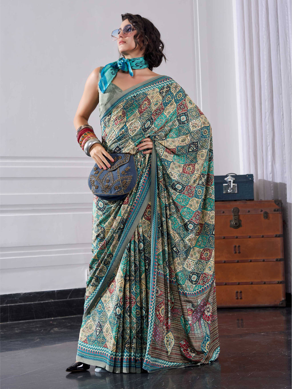 Teal Green Ethnic Motif Crepe Silk Saree