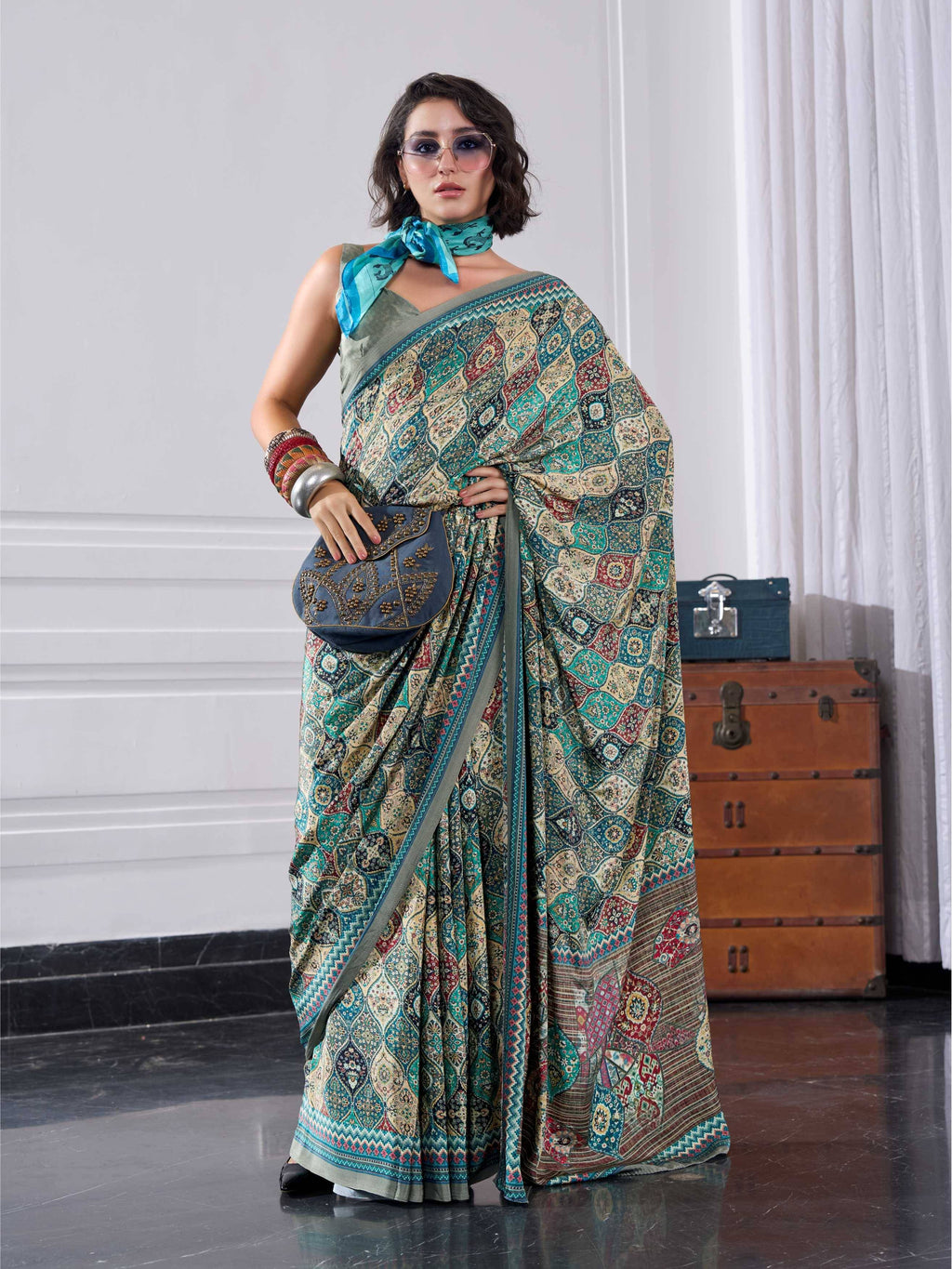Teal Green Ethnic Motif Crepe Silk Saree